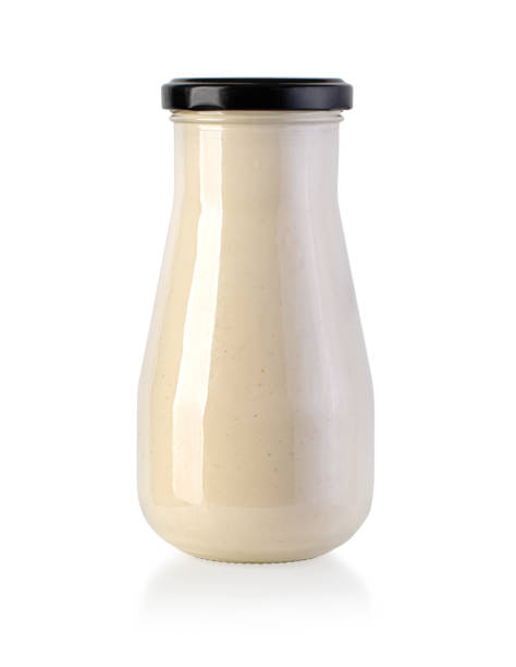 istock White barbecue sauce in glass jar 1320943675