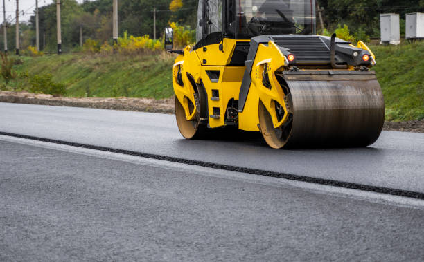 istock Asphalt road roller with heavy vibration roller compactor press new hot asphalt on the roadway on a road construction site. Heavy Vibration roller at asphalt pavement working. Repairing. 1320945927