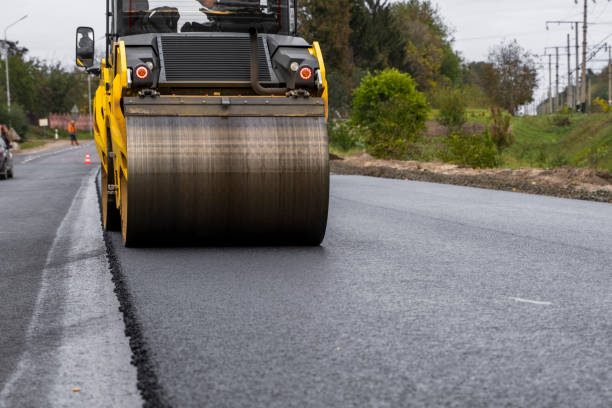 istock Asphalt road roller with heavy vibration roller compactor press new hot asphalt on the roadway on a road construction site. Heavy Vibration roller at asphalt pavement working. Repairing. 1320946066