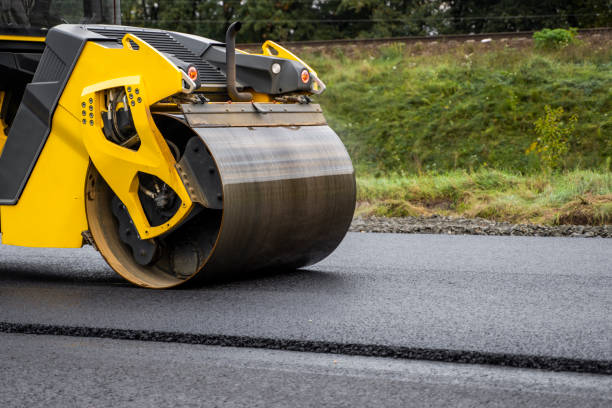 istock Asphalt road roller with heavy vibration roller compactor press new hot asphalt on the roadway on a road construction site. Heavy Vibration roller at asphalt pavement working. Repairing. 1320946171