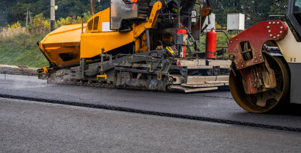 istock Asphalt road roller with heavy vibration roller compactor press new hot asphalt on the roadway on a road construction site. Heavy Vibration roller at asphalt pavement working. Repairing. 1320946352