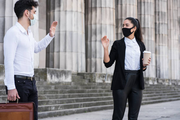 istock Business people keeping social distance. 1320946384