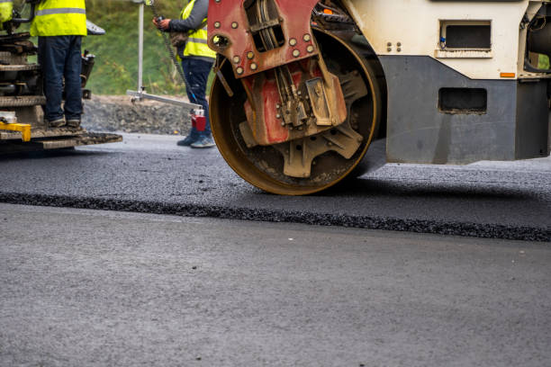 istock Asphalt road roller with heavy vibration roller compactor press new hot asphalt on the roadway on a road construction site. Heavy Vibration roller at asphalt pavement working. Repairing. 1320947802