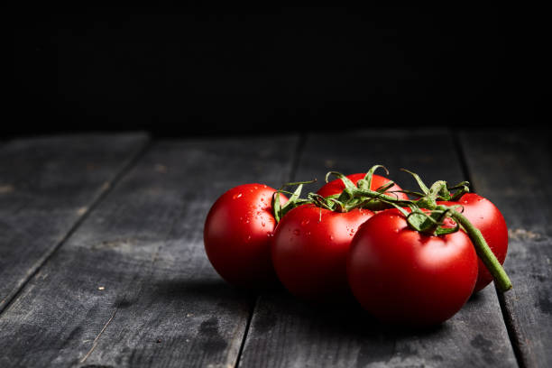 stock photo of tomatoes on a stem background - flocked imagens e fotografias de stock