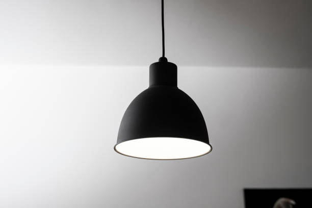 istock Industrial black look pendant lamps in a kitchen interior. Modern loft interior design. 1320948002