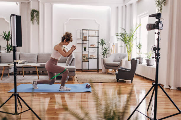 istock Fitness vlogger exercising at home 1320948594