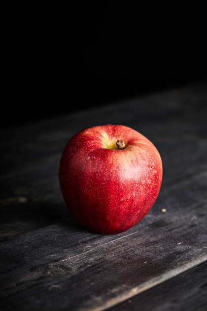 istock fresh red apple on a wooden table 1320948655