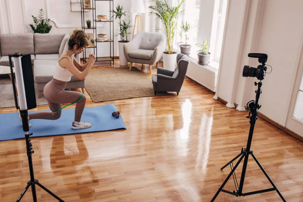 istock Fitness vlogger exercising at home 1320948734
