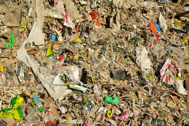 istock Garbage dump with construction waste. Trash disposal and food waste 1320948911