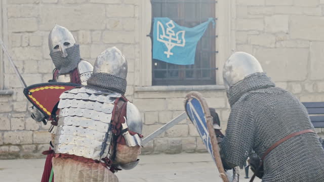 Fighting knights. Outdoor, in front of castle
