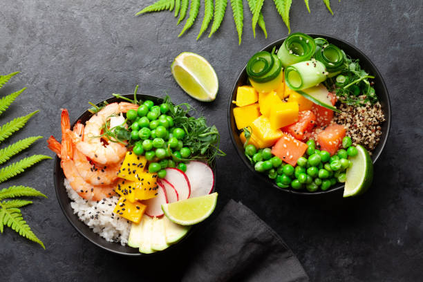 istock Poke bowls with shrimps, salmon, avocado and mango 1320949422