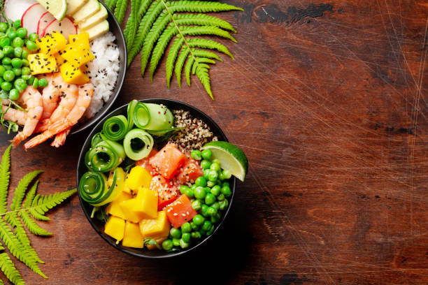 istock Poke bowls with shrimps, salmon, avocado and mango 1320950252