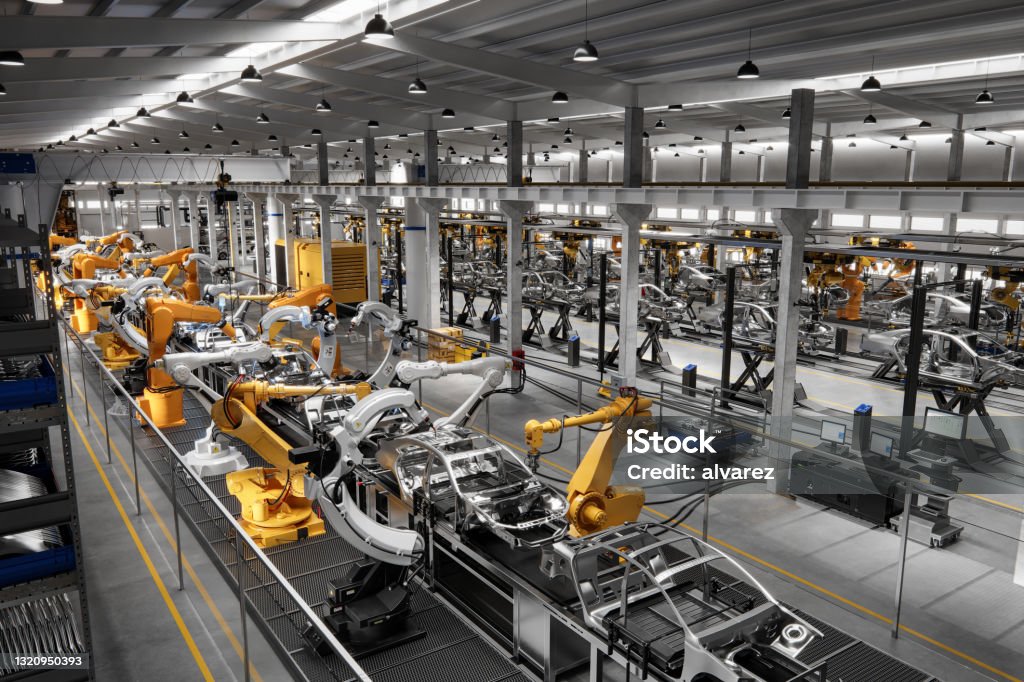 Cars on production line in factory High angle view of cars on production line in factory. Many robottic arms doing welding on car metal body in manufacturing plant. Image in 3D render. Manufacturing Stock Photo