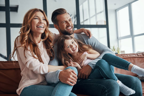 istock Happy young family smiling and embracing 1320950758