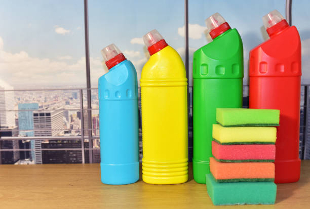 istock Detergents liquid and sponge for washing on the window background. Detergent laundry bottle for washing and dishwasher. 1320950838