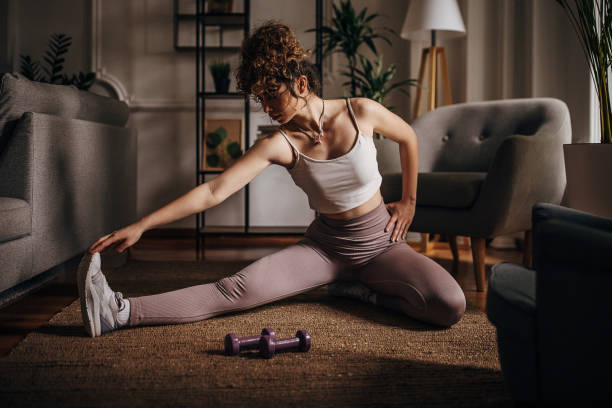 istock Young woman exercise at home 1320951887