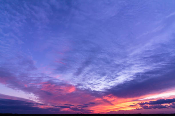 istock Colorful sunset with clouds in the evening 1320952502