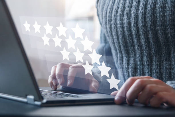Customer review satisfaction feedback concept, man rating service online and writing review stock photo