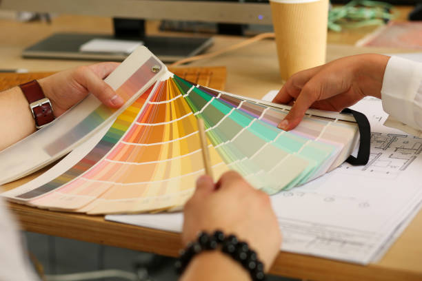 istock Graphic designer arms searching proper colour 1320957781