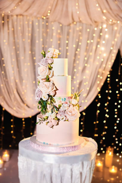 istock Luxury wedding cake on restaurant interior background 1320959194