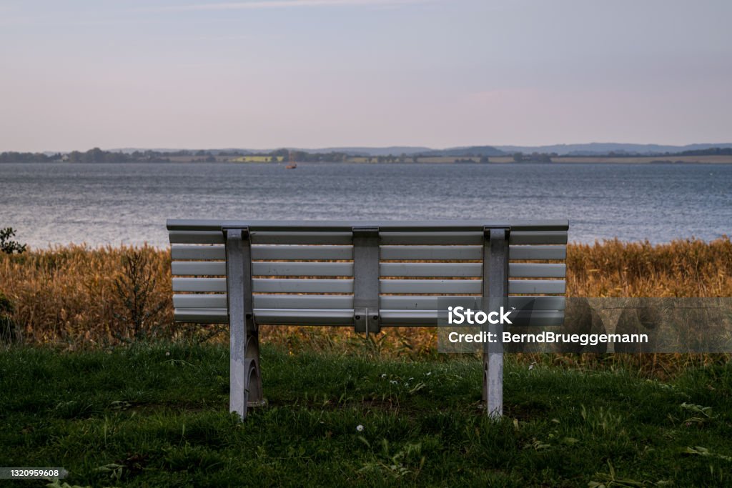 A bench with a view, seen near Gager, Mecklenburg-Western Pomerania, Germany A bench with a view across the Hagensche Wiek near Gager, Mecklenburg-Western Pomerania, Germany Baltic Sea Stock Photo