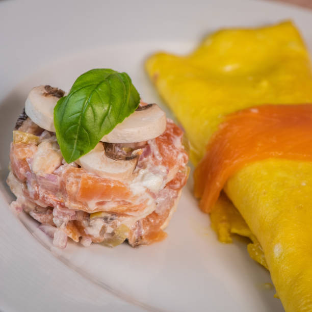 istock Omelette with salmon and tomatoes, served on plate, traditional Norwegian dish 1320960752