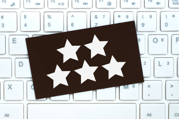 istock 5 stars drawn on brown paper card, online service customer feedback concept 1320960759