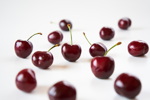 dark cherry fruits on white background