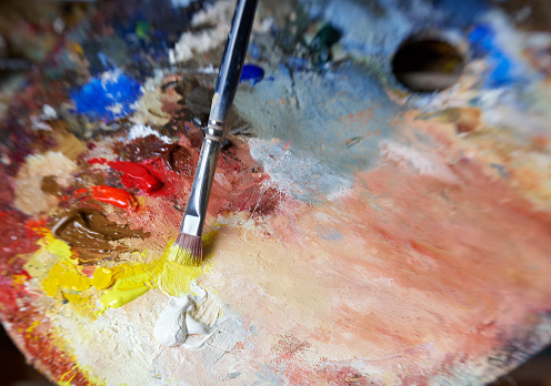 Still life of artist's palette with paint brush. Lens used for effect is Lensbaby.