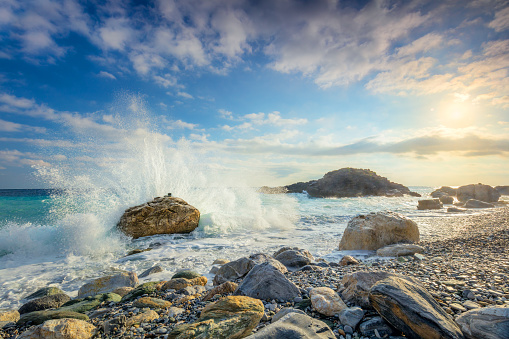 Powerful  Sea wave crash on big stone in beautiful white splashes. Seascape. Panoramic view of the seashore