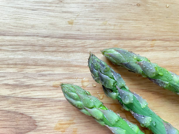 istock Close-up of asparagus on cutting board 1320968447