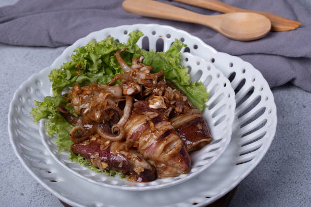 istock Fried squid with garlic in a semic dish 1320969380