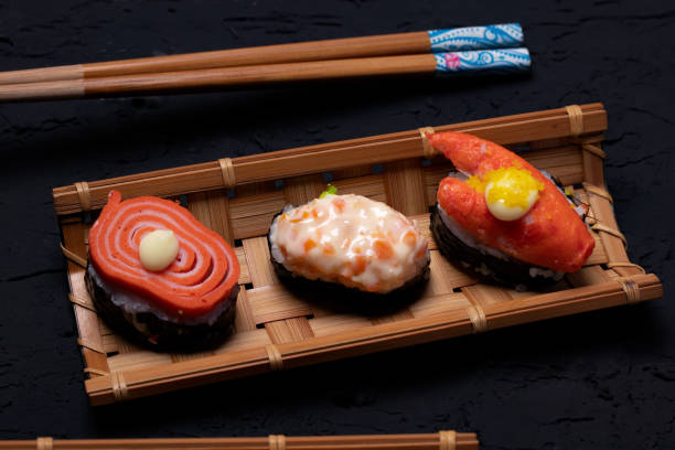 istock Sushi in bamboo on black background 1320969473