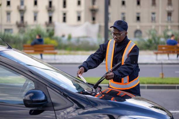 istock Young and committed African American public worker working as a parking supervisor 1320970622