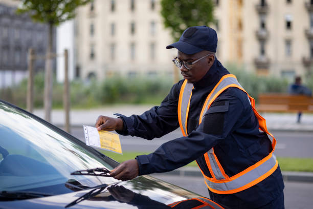 istock Young and committed African American public worker working as a parking supervisor 1320970623