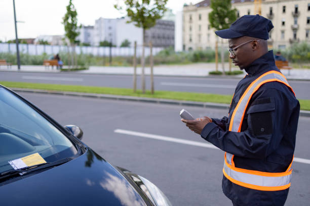 istock Young and committed African American public worker working as a parking supervisor 1320970729