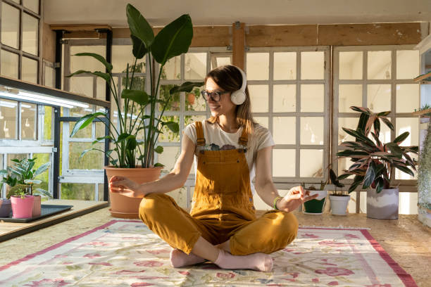 istock Young Woman Sitting On Potted Plant 1320970829
