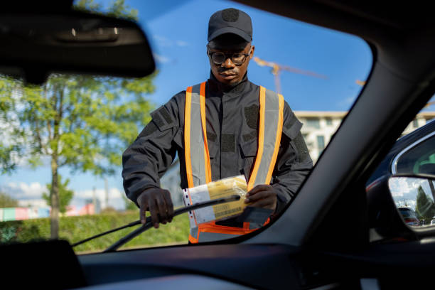 istock Young and committed African American public worker working as a parking supervisor 1320970880