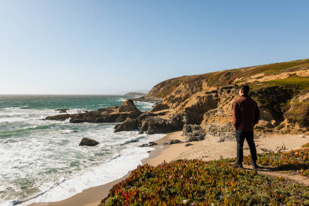 istock Man taking in view of the ocean and beach 1320971310