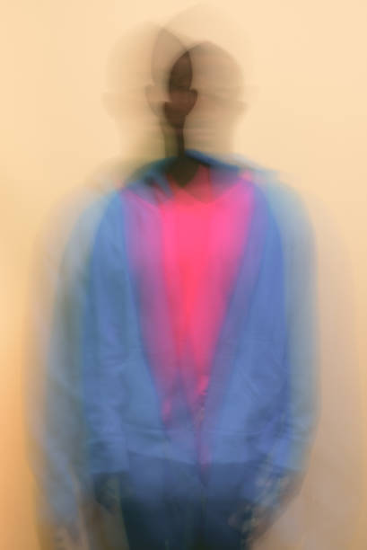 istock Defocused Image Of Man Standing Against Yellow Background 1320972192