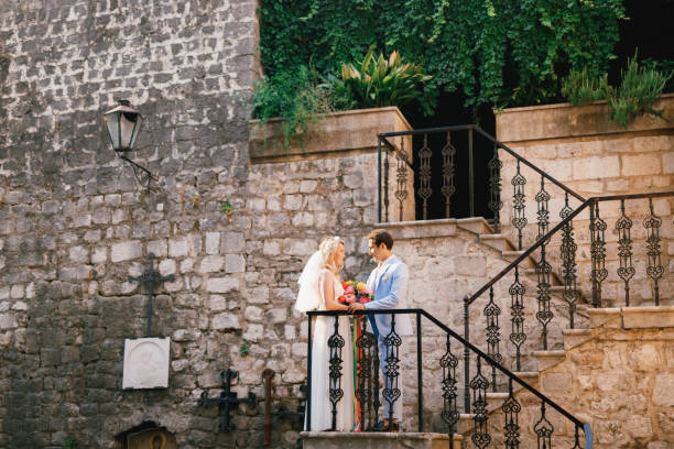 istock Young Couple Standing Near Railing 1320972298