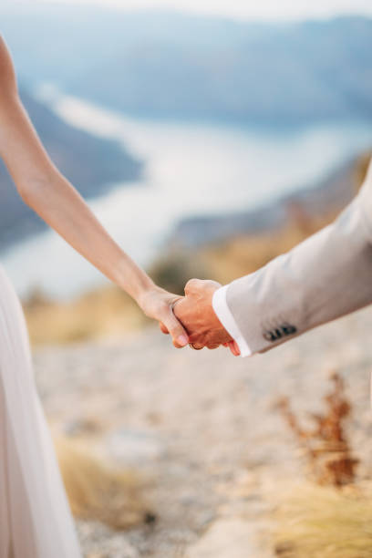 istock Couple Holding Hands Outdoors 1320973681