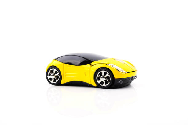 istock Fancy mouse for computer or desktop , pc in the shape of a yellow car isolated on white background. 1320973958