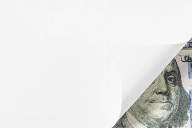 istock White Empty Page Curl Over American One Hundred Dollar Bill 1320976280