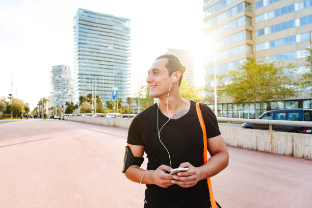istock Happy young strong sports man outdoors walking 1320976362