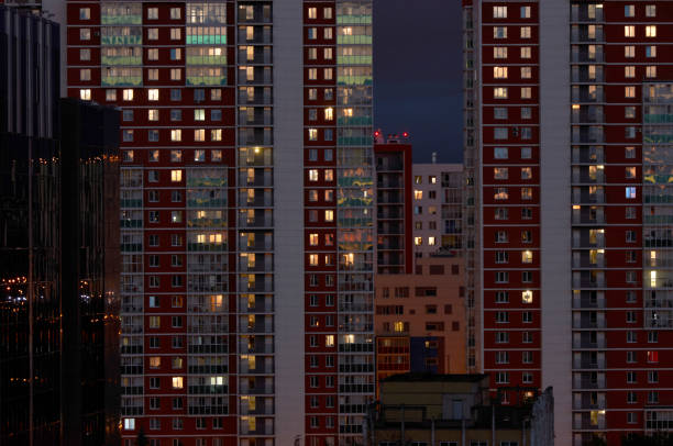 istock Building windows at night. Abstract urban skyscraper 1320977525