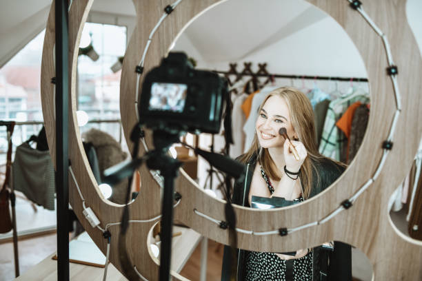 istock Smiling Female Recording Video Tutorial About Make Up Brush Skills 1320978014