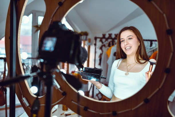 istock Smiling Female Describing Make Up Aesthetic Techniques On Vlog 1320978074