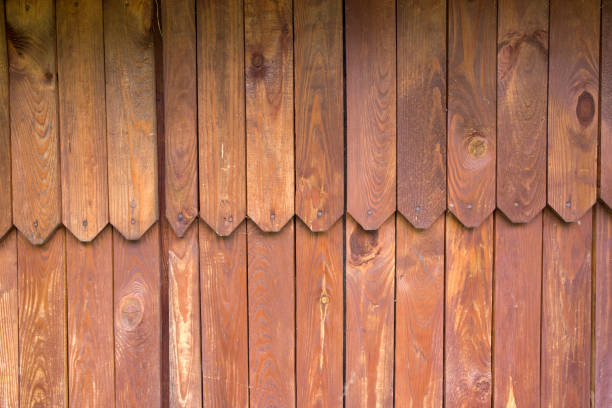 istock Rough wooden fence. Rusty brown nice background Texture closeup front view 1320979457