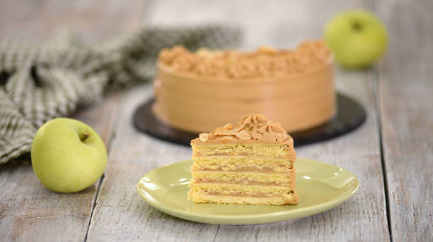 istock Piece of apple layer cake with caramel cream. 1320980712
